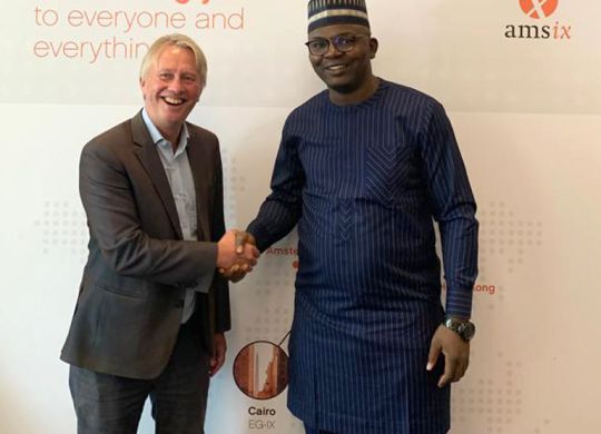 Oluwasayo Oshadami (right), GM, Technical Solutions, MainOne, and International Partnership Director Onno Bos (left) of AMS-IX, signed the deal during the African Peering Forum (AfPIF) in Kigali.